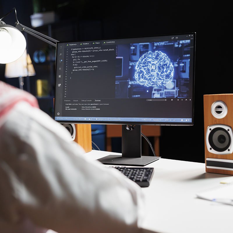 Arab guy utilizes AI on desktop computer